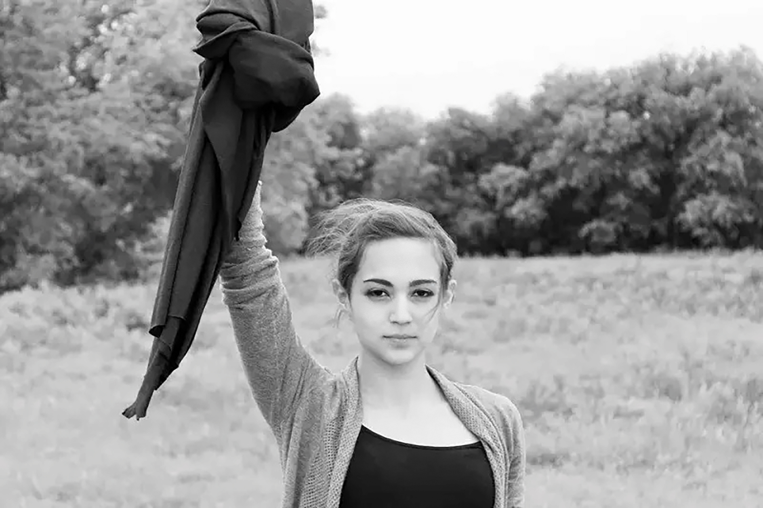 The Liberty Foundation - About - Iranian woman protesting by removing their hijab